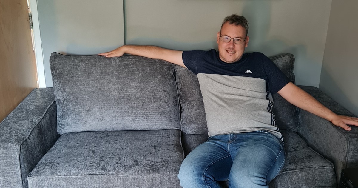 Denis relaxing on his new sofa